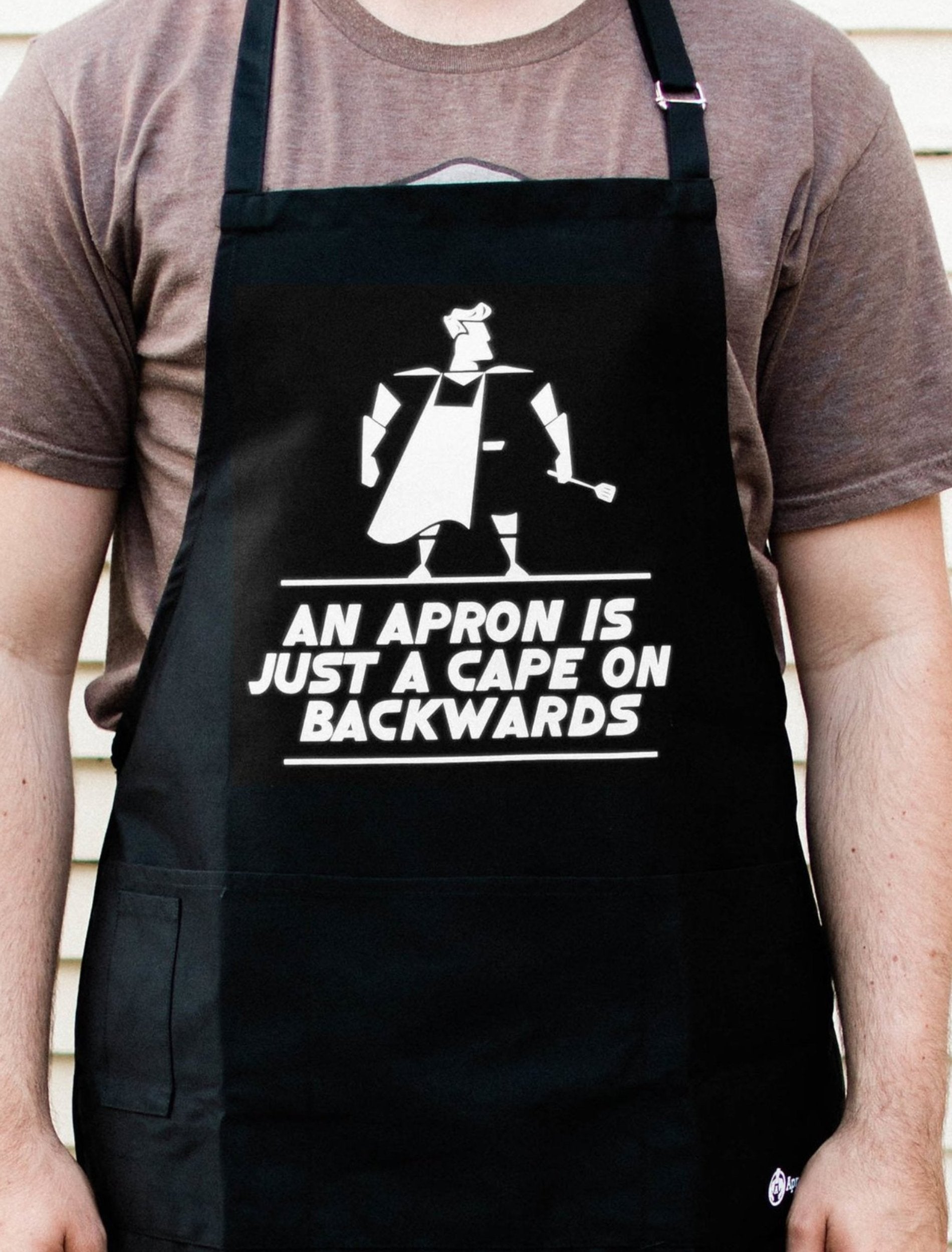 WHAT ON EARTH Cape Backwards Apron - Funny Kitchen Apron, Black Cooking  Smock