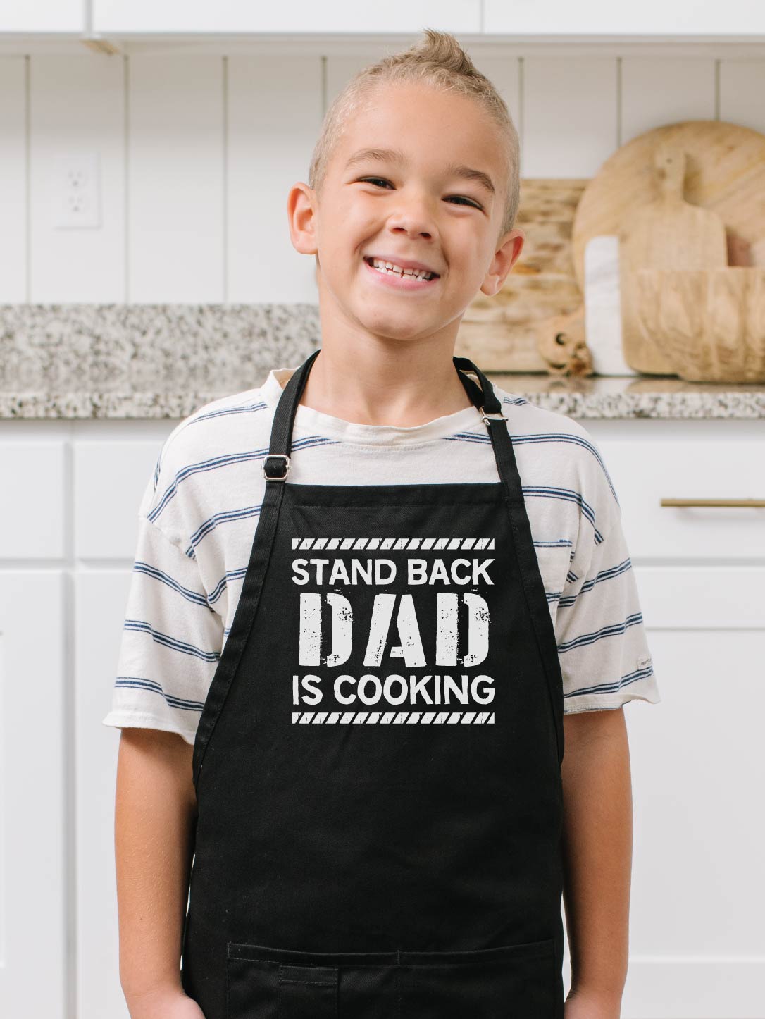 https://www.apronmen.com/cdn/shop/products/apron-standback-kids-black_hero_boy-v6-1080px.jpg?v=1606360765